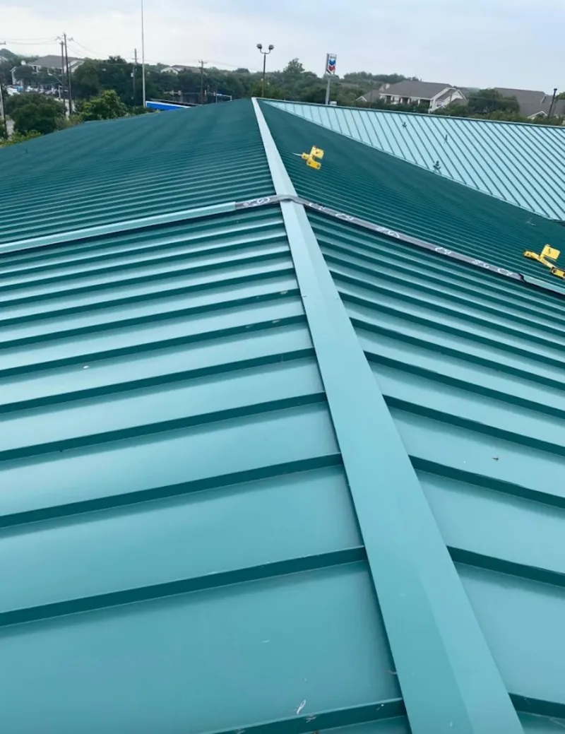 Green commercial metal roof ridge and valley for Metal Roof Repair in Ocean Springs
