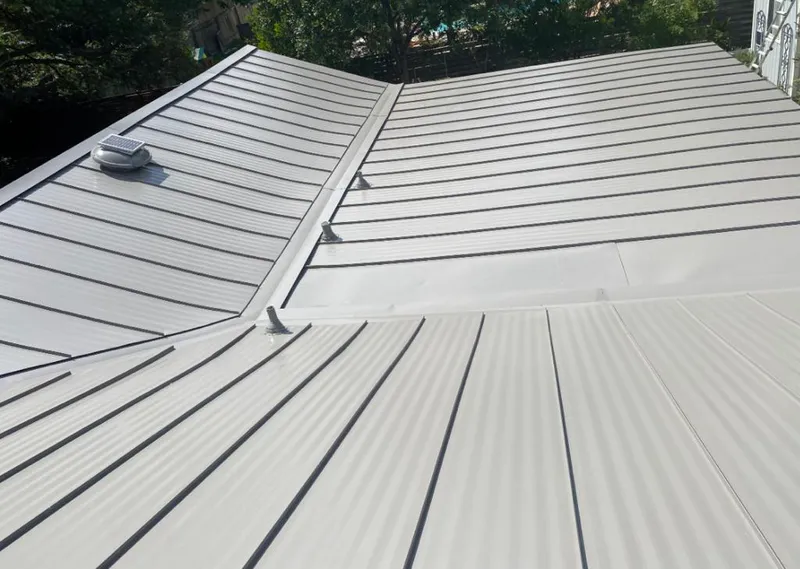 Solar attic fan installed on a metal roof for Roof Ventilation in Ocean Springs